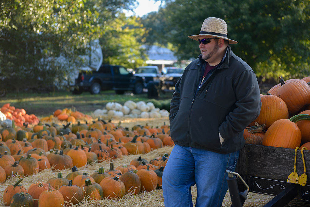 Jeff Singer, who works at Hackman Farms, waits for customers